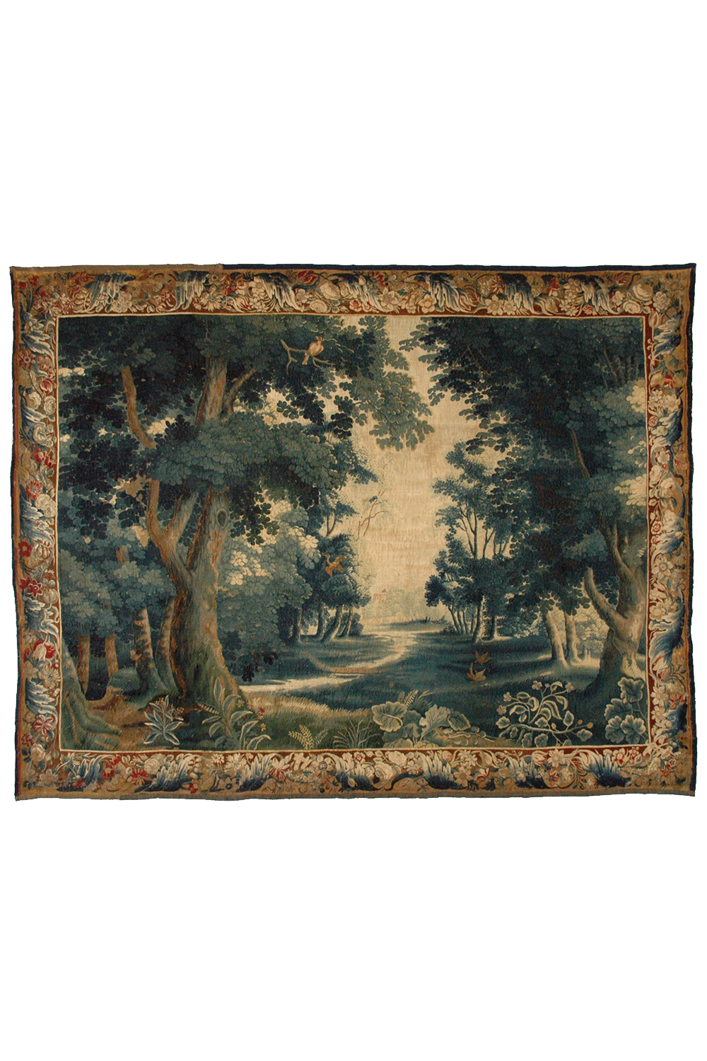 This image features a French Verdure tapestry, showcasing an intricate woodland scene with lush trees, dense foliage, and a serene, sunlit clearing in the background. The tapestry is bordered by a detailed floral pattern, enhancing its classical elegance. The deep, rich greens and earthy tones are characteristic of 17th-century Verdure tapestries. This wall hanging exemplifies the masterful weaving techniques and artistic finesse typical of the Baroque period's textile art. Ideal for those interested in ant