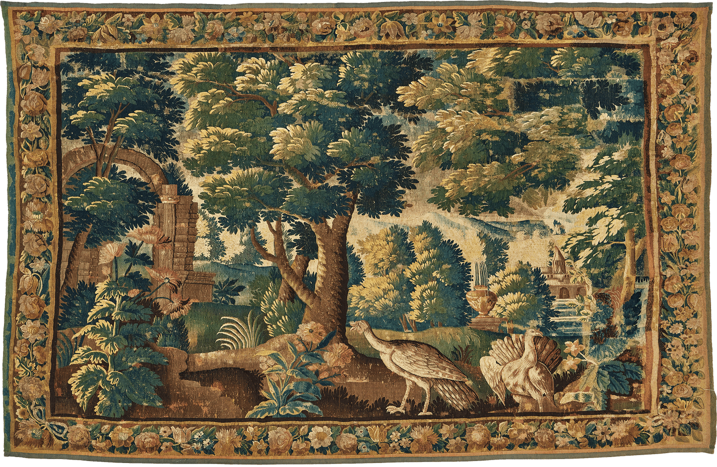This verdure tapestry is a striking representation of a bucolic landscape, exquisitely crafted to bring the tranquility of nature into any room. The scene unfolds with towering trees and vibrant greenery, meticulously woven to capture the essence of a secluded grove. A quaint stone archway leads to a serene water feature, further enhancing the peacefulness of the tableau. re588996 